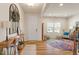 Welcoming entryway with hardwood floors, a staircase, and stylish console table enhancing its charm at 3422 Norway Spruce Rd, Raleigh, NC 27616
