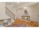 Bright entryway with wood floors, a staircase, and stylish décor enhancing the inviting ambiance at 3422 Norway Spruce Rd, Raleigh, NC 27616