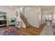 Bright entryway with a staircase, a stylish rug, and comfortable seating creating a welcoming space at 3422 Norway Spruce Rd, Raleigh, NC 27616