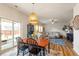 Open-concept living room and dining area with sliding doors to the patio and backyard at 3422 Norway Spruce Rd, Raleigh, NC 27616