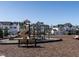 Community playground with slide, bench, and play equipment in a new home community at 3422 Norway Spruce Rd, Raleigh, NC 27616