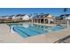 Community pool with lap lanes and a fenced perimeter, surrounded by neighborhood homes and community center at 3422 Norway Spruce Rd, Raleigh, NC 27616
