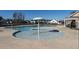 Community pool and splash pool with an umbrella in a new home community at 3422 Norway Spruce Rd, Raleigh, NC 27616