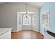 Bright breakfast nook features a stylish chandelier and a bay window offering plenty of natural light at 3519 Streams Of Fields Dr, Raleigh, NC 27604