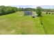 Areal view of home and outbuilding surrounded by green pastures at 3805 Euliss Rd, Burlington, NC 27215