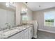 Spacious bathroom features a double sink vanity with granite counters and updated fixtures at 3805 Euliss Rd, Burlington, NC 27215