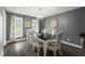 Elegant dining room showcasing a stylish chandelier, large table, and natural light from the windows at 3805 Euliss Rd, Burlington, NC 27215