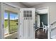 Inviting front door with glass panes, showing a glimpse of the dining area and front porch at 3805 Euliss Rd, Burlington, NC 27215