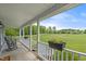 Cozy front porch with rocking chairs and flower boxes, offering a relaxing outdoor space with a view at 3805 Euliss Rd, Burlington, NC 27215