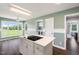 Bright kitchen featuring stainless appliances, kitchen island and backyard view at 3805 Euliss Rd, Burlington, NC 27215
