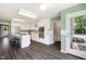 Bright kitchen featuring white cabinets, stainless steel appliances, a kitchen island, and modern backsplash at 3805 Euliss Rd, Burlington, NC 27215