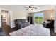 Living room with dark wood floors, rug, reclining couch, safe and view to outdoor patio at 3805 Euliss Rd, Burlington, NC 27215