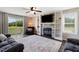 Living room features a fireplace, built-in shelving, and a sliding glass door to the backyard at 3805 Euliss Rd, Burlington, NC 27215