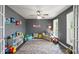 Playroom with grey walls, wood floors, natural light, and toys at 3805 Euliss Rd, Burlington, NC 27215