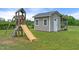 Lush backyard featuring a play structure and storage shed at 3805 Euliss Rd, Burlington, NC 27215