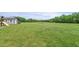 Expansive green lawn with mature trees and plenty of space at 3805 Euliss Rd, Burlington, NC 27215