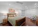Cozy bedroom boasts recessed lighting, hardwood floors, and built-in shelves at 3915 Nottaway Rd, Durham, NC 27707