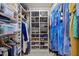 Well-organized closet with shelves and hanging racks at 3915 Nottaway Rd, Durham, NC 27707