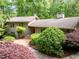 Charming home featuring mature landscaping, brick walkway, and a stylish gray facade at 3915 Nottaway Rd, Durham, NC 27707