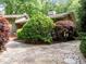 Exterior of home featuring stone pathway leading to front of house and beautiful landscaping at 3915 Nottaway Rd, Durham, NC 27707