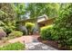 Charming home exterior featuring a brick walkway, well-maintained landscaping, and a welcoming front entrance at 3915 Nottaway Rd, Durham, NC 27707