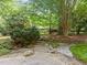 Lush front yard with stone pathway leading up to the house at 3915 Nottaway Rd, Durham, NC 27707