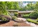 Beautifully landscaped front yard with a stone walkway leading to the front door at 3915 Nottaway Rd, Durham, NC 27707