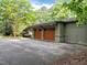 Detached garage with parking pad and lush surroundings at 3915 Nottaway Rd, Durham, NC 27707