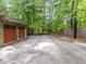 Spacious garage with an adjacent driveway featuring a basketball hoop at 3915 Nottaway Rd, Durham, NC 27707