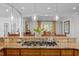 Beautiful kitchen island featuring a granite top and gas cooktop, perfect for culinary creations at 3915 Nottaway Rd, Durham, NC 27707