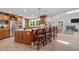 Spacious kitchen with island seating, stainless steel appliances, and seamless flow to the living room at 3915 Nottaway Rd, Durham, NC 27707