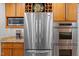 Modern kitchen featuring stainless steel appliances, wood cabinets, and plenty of counter space at 3915 Nottaway Rd, Durham, NC 27707