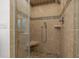 Modern tiled shower with built-in seat and multiple shower heads at 3915 Nottaway Rd, Durham, NC 27707