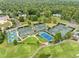 Aerial view of tennis and pickleball courts surrounded by lush greenery at 3915 Nottaway Rd, Durham, NC 27707