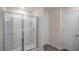 Bathroom with glass-enclosed shower, tiled walls, and a private toilet area at 400 Ember St, Sanford, NC 27330