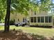 The backyard has an outdoor patio with cushioned furniture and a screened-in porch at 402 Troycott Pl, Cary, NC 27519