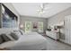 Bedroom featuring two twin beds, neutral colors, and ample natural light at 402 Troycott Pl, Cary, NC 27519