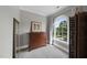 Bright bedroom featuring a traditional dresser, arched window and gray walls and carpet at 402 Troycott Pl, Cary, NC 27519