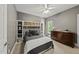 Neutral bedroom with shelving, abundant drawer space, and a sunny window with tranquil views at 402 Troycott Pl, Cary, NC 27519