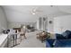 Versatile bonus room features seating area, desk space, vaulted ceilings, and neutral walls for flexible use at 402 Troycott Pl, Cary, NC 27519