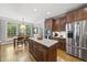 This spacious kitchen boasts stainless steel appliances, hardwood floors and a center island at 402 Troycott Pl, Cary, NC 27519