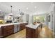 This spacious kitchen boasts stainless steel appliances, hardwood floors and a center island at 402 Troycott Pl, Cary, NC 27519