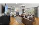 The living room has a fireplace, a ceiling fan, and built in shelving at 402 Troycott Pl, Cary, NC 27519