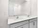 Bright bathroom featuring a double vanity with white countertops and modern faucets at 404 Ember St, Sanford, NC 27330