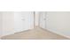 Bedroom featuring double closets and neutral carpet at 404 Ember St, Sanford, NC 27330