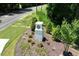 Entrance to community featuring lush landscaping and a stone sign at 404 Ember St, Sanford, NC 27330