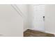 Welcoming entryway featuring durable wood-look flooring and a stylish white front door at 404 Ember St, Sanford, NC 27330