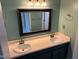 Bright bathroom featuring a double sink vanity and neutral wall color at 409 Vista Springs Cir, Holly Springs, NC 27540