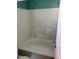 Tiled bathtub and shower offering a clean and modern bathroom experience at 409 Vista Springs Cir, Holly Springs, NC 27540
