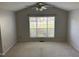 Bedroom with large window offering natural light and exterior views at 409 Vista Springs Cir, Holly Springs, NC 27540